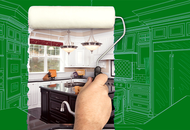 paint roller over blueprint of remodeled kitchen