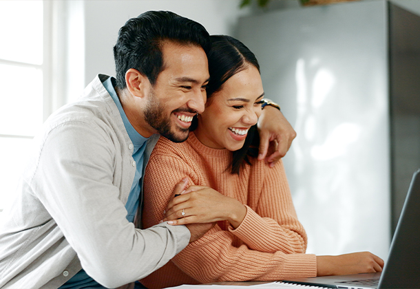 couple embracing and smiling