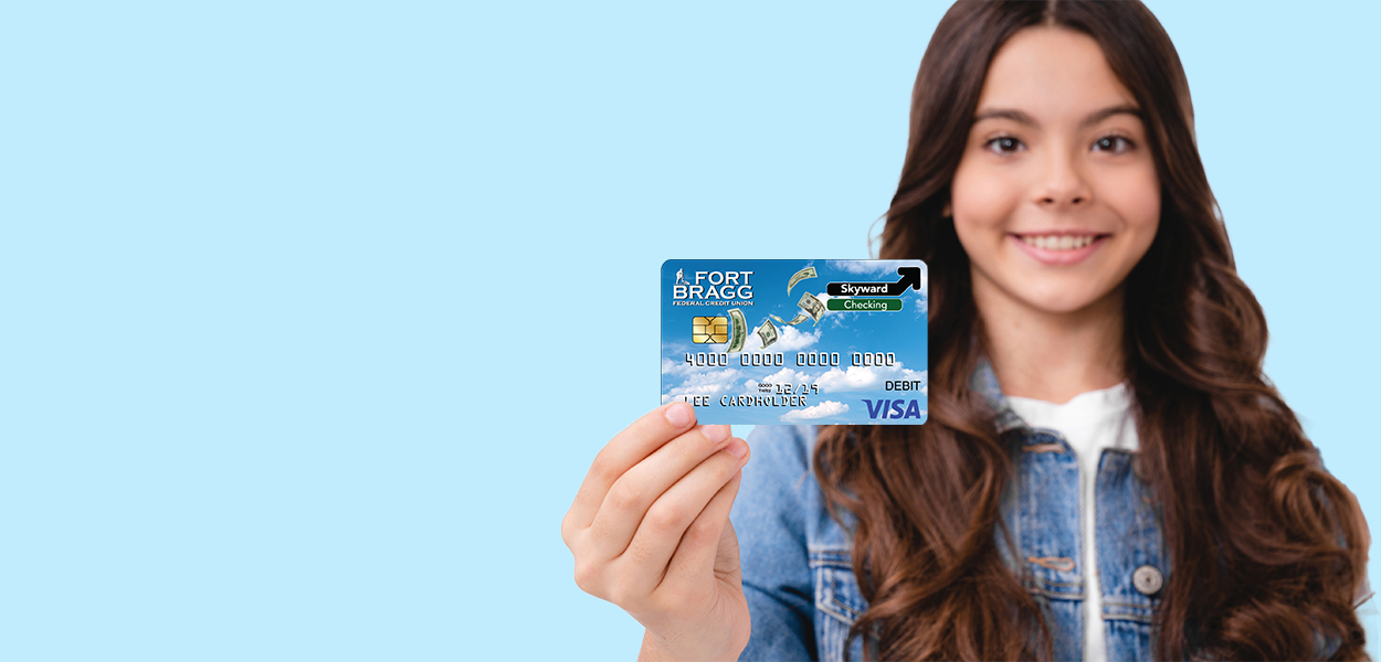 youth holding a Fort Bragg card